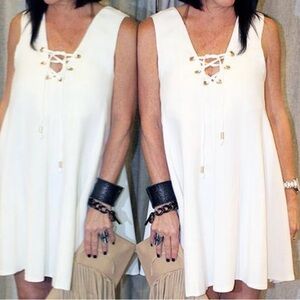 ETIQUETTE. Off White Mini Dress. Lace up. Size Medium. Sleeveless.